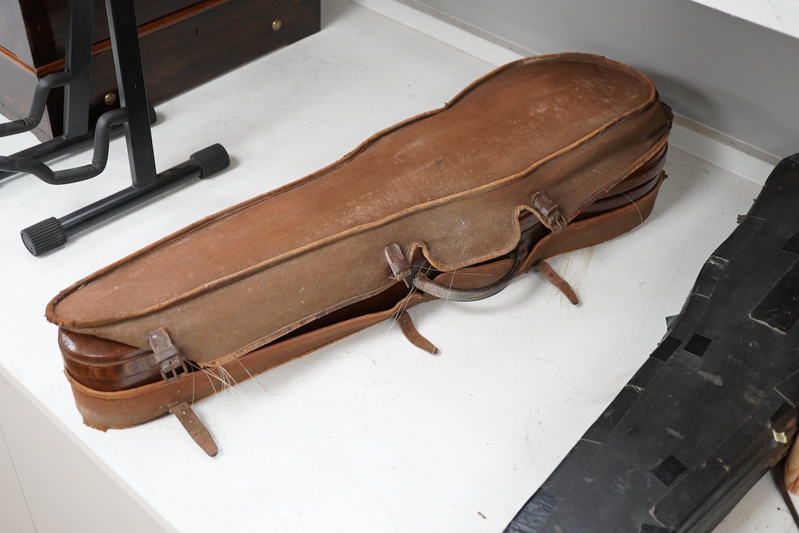 A late 19th century German violin in a Hill & Son oak case, with Hill canvas slip cover, together with an unbranded silver mounted bow, and another, ivory submission ref: 9HJU3B45 and ZC2E1GCP